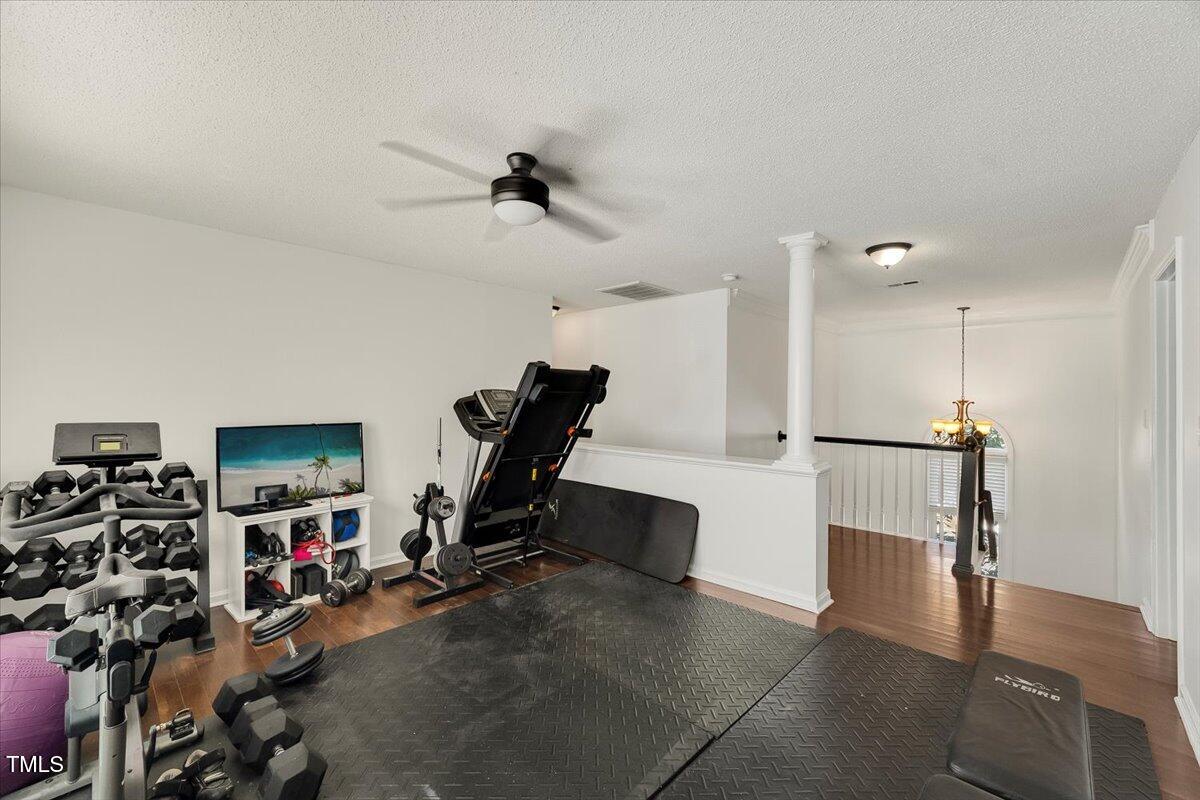 9813 Rockledge Drive Raleigh, NC 27617 - Photo 38 of 52 a view of a room with gym equipment