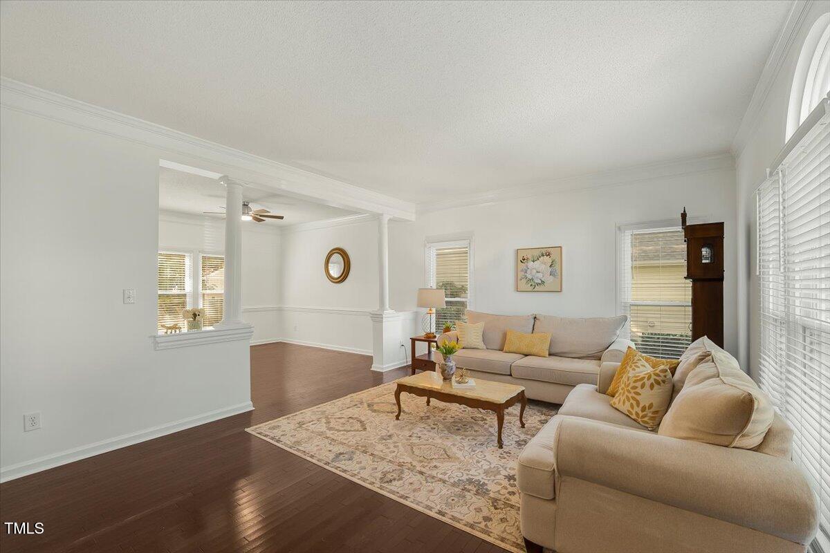 9813 Rockledge Drive Raleigh, NC 27617 - Photo 4 of 52 a living room with furniture and wooden floor