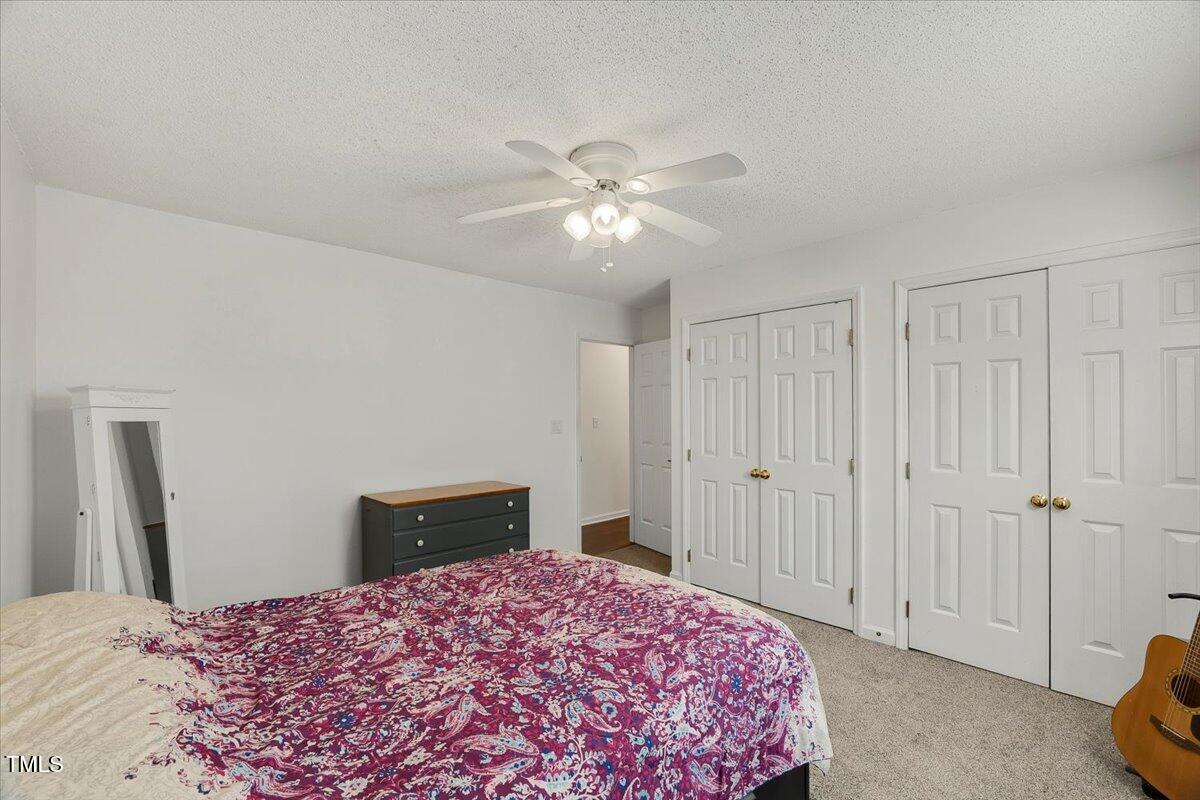 9813 Rockledge Drive Raleigh, NC 27617 - Photo 50 of 52 a bedroom with a bed and a closet