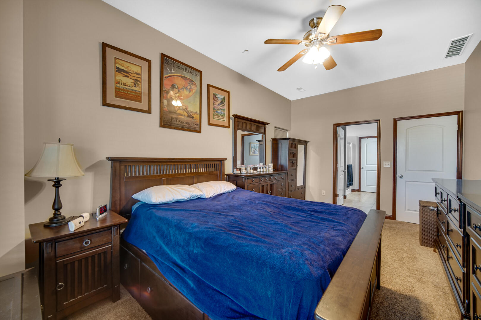 123 North Main Street, Unit 301 Crown Point, IN 46307 - Photo 17 of 25 a bed room with a bed and a chandelier