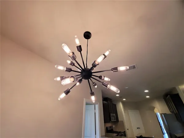 a view of a hallway with a chandelier