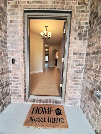 a view of a entryway door with wooden floor