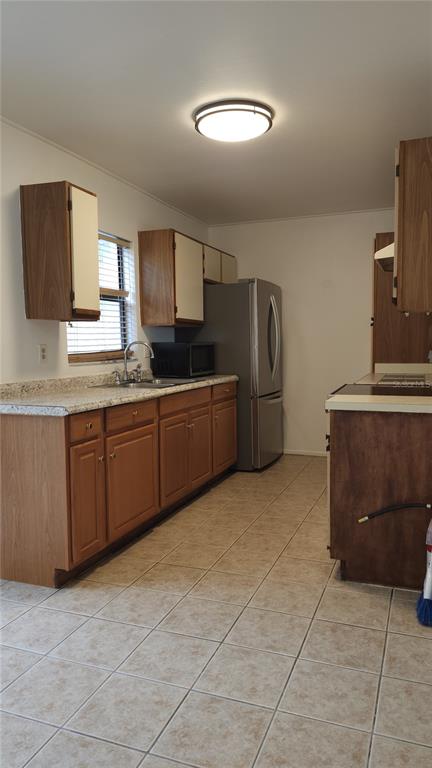 1737 Shady Ridge Court, Unit 231 Orlando, FL 32807 - Photo 12 of 30 a kitchen with stainless steel appliances granite countertop a stove a sink and a refrigerator