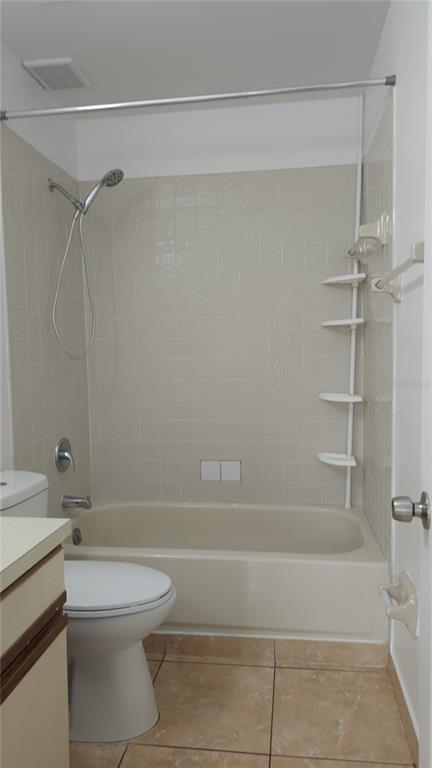 1737 Shady Ridge Court, Unit 231 Orlando, FL 32807 - Photo 18 of 30 a bathroom with a toilet and shower