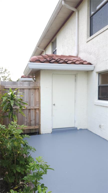 1737 Shady Ridge Court, Unit 231 Orlando, FL 32807 - Photo 28 of 30 a house with trees in front of it
