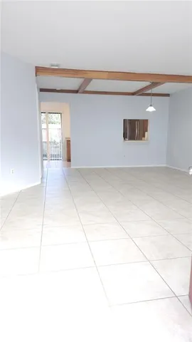 a view of an empty room with windows