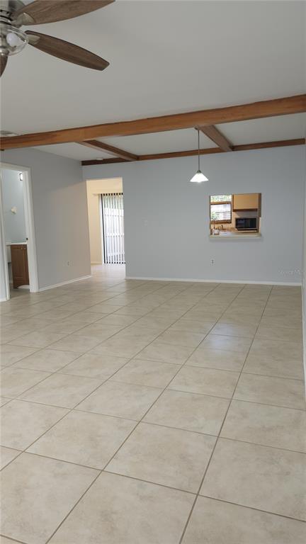 1737 Shady Ridge Court, Unit 231 Orlando, FL 32807 - Photo 9 of 30 a view of a livingroom with wooden floor and a window