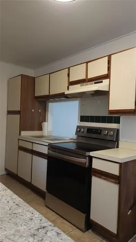 a kitchen with a stove and a microwave