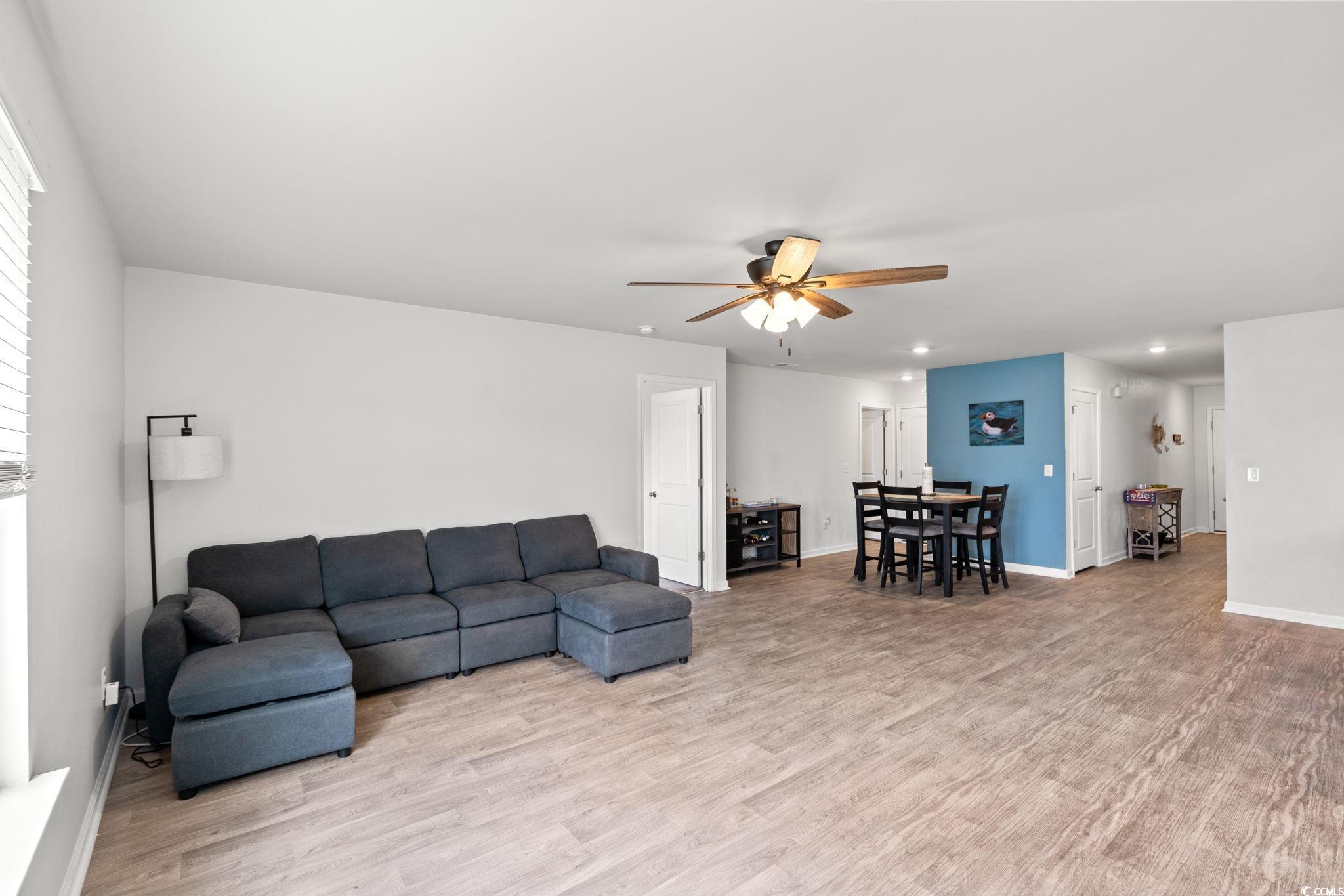 821 Twickenham Loop Longs, SC 29568 - Photo 8 of 35 Living room with light wood finished floors, ceiling fan, and recessed lighting