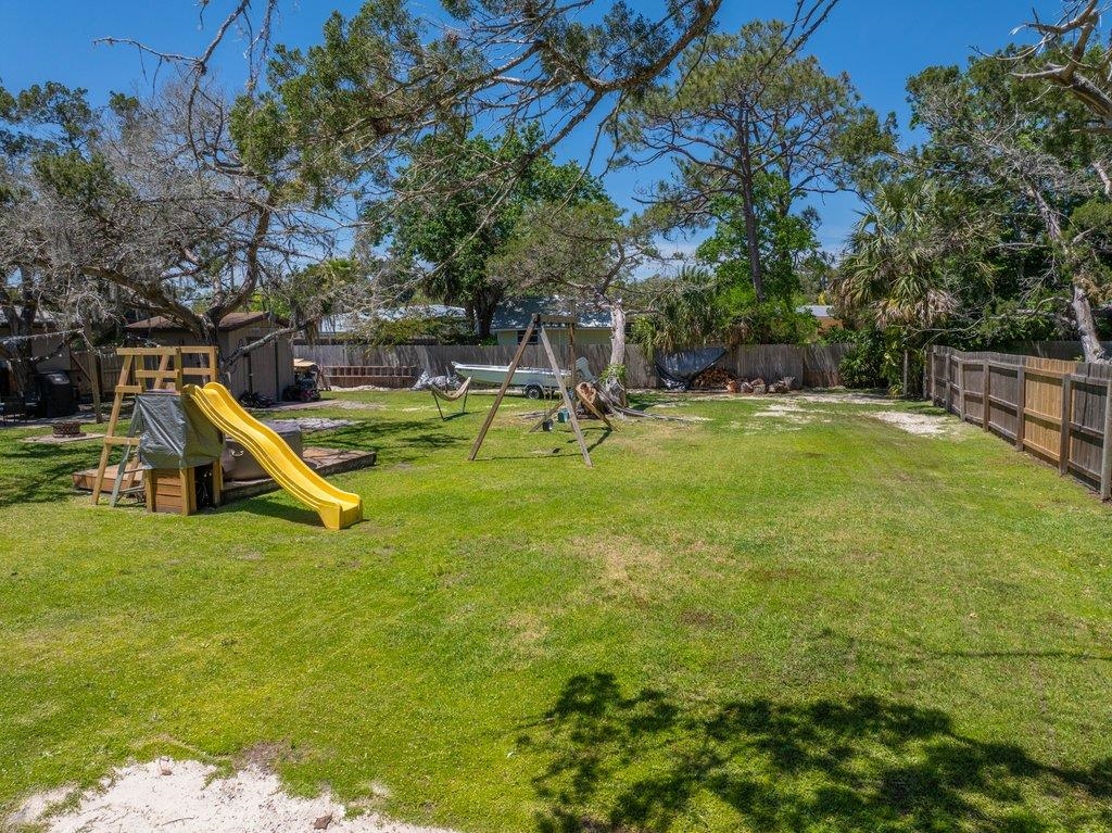 204 Coquina Avenue St. Augustine, FL 32080 - Photo 13 of 14 a view of a swimming pool with a bench