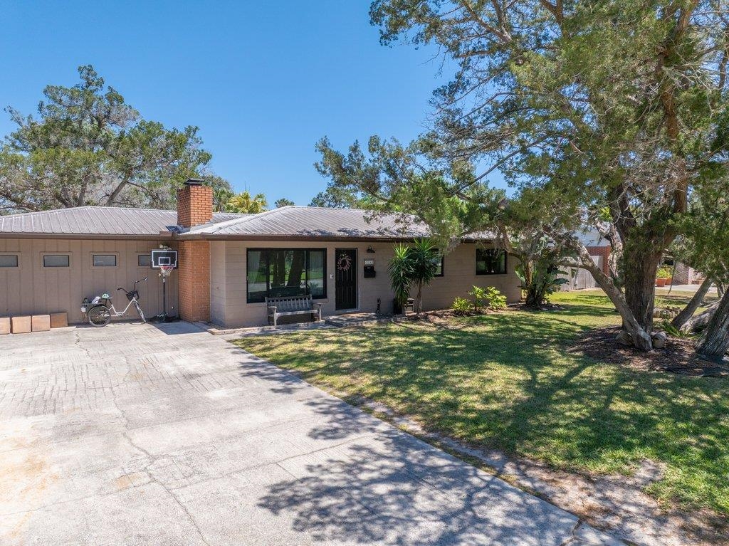 204 Coquina Avenue St. Augustine, FL 32080 - Photo 14 of 14 a front view of a house with a yard