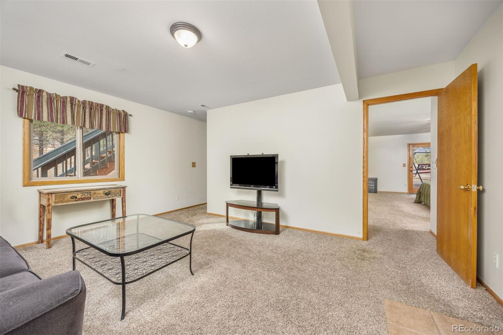 1768 Bluebird Drive Bailey, CO 80421 - Photo 21 of 50 a living room with furniture