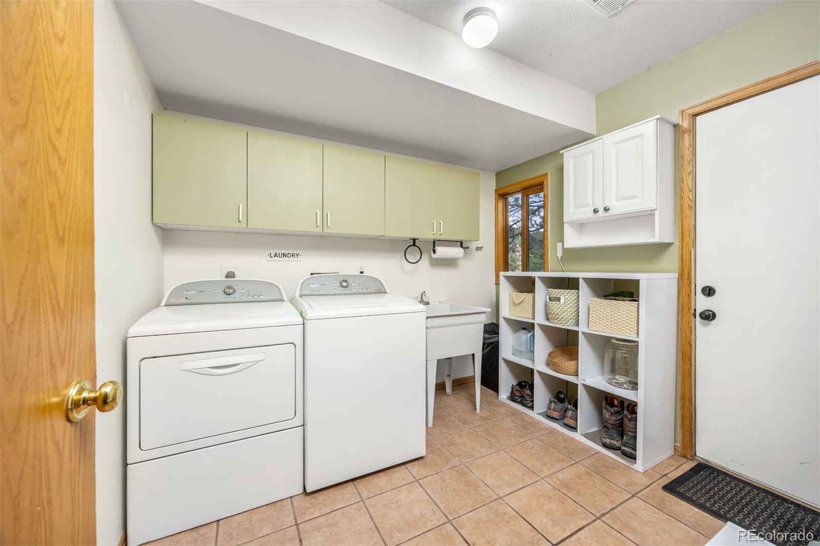 1768 Bluebird Drive Bailey, CO 80421 - Photo 26 of 50 a utility room with dryer and washer