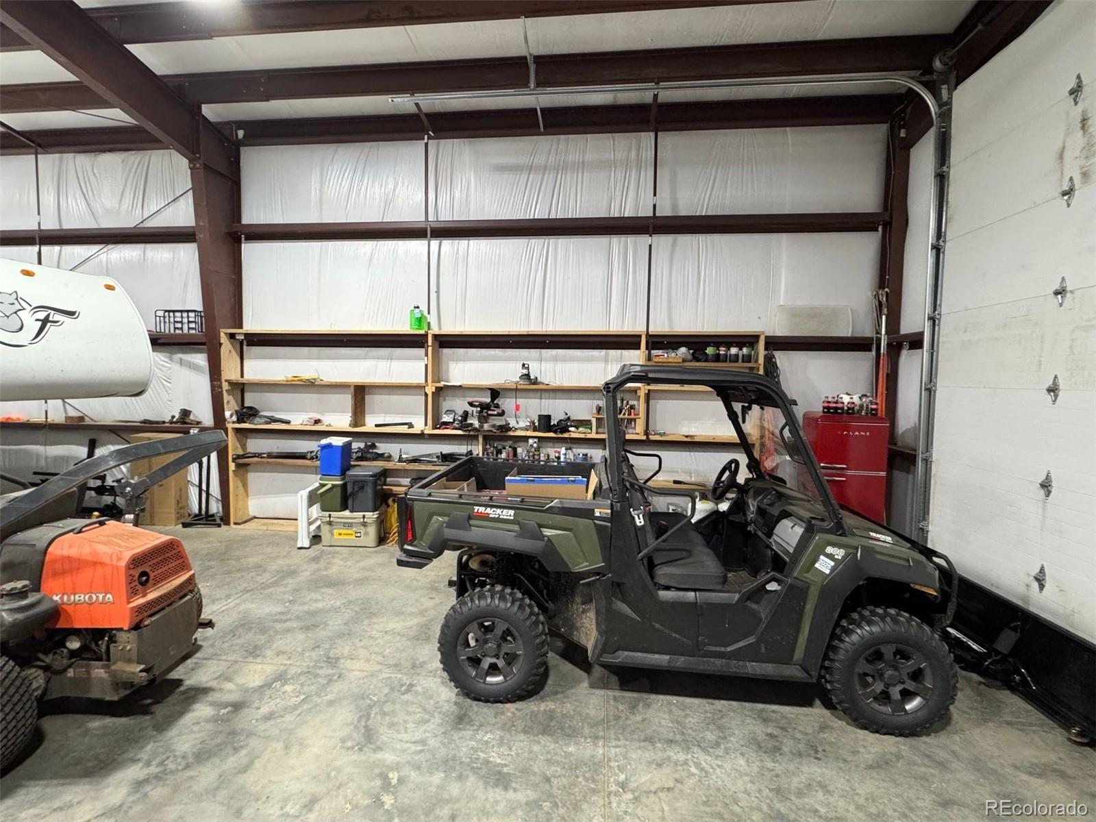 1768 Bluebird Drive Bailey, CO 80421 - Photo 43 of 50 a car parked in a garage