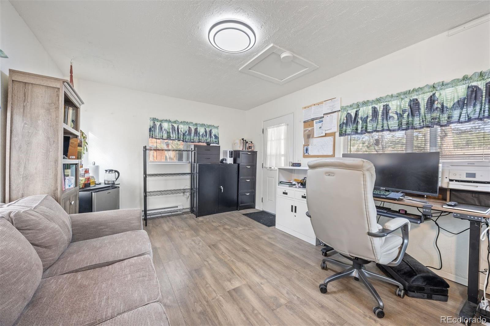 1768 Bluebird Drive Bailey, CO 80421 - Photo 5 of 50 a view of a workspace with furniture and a window