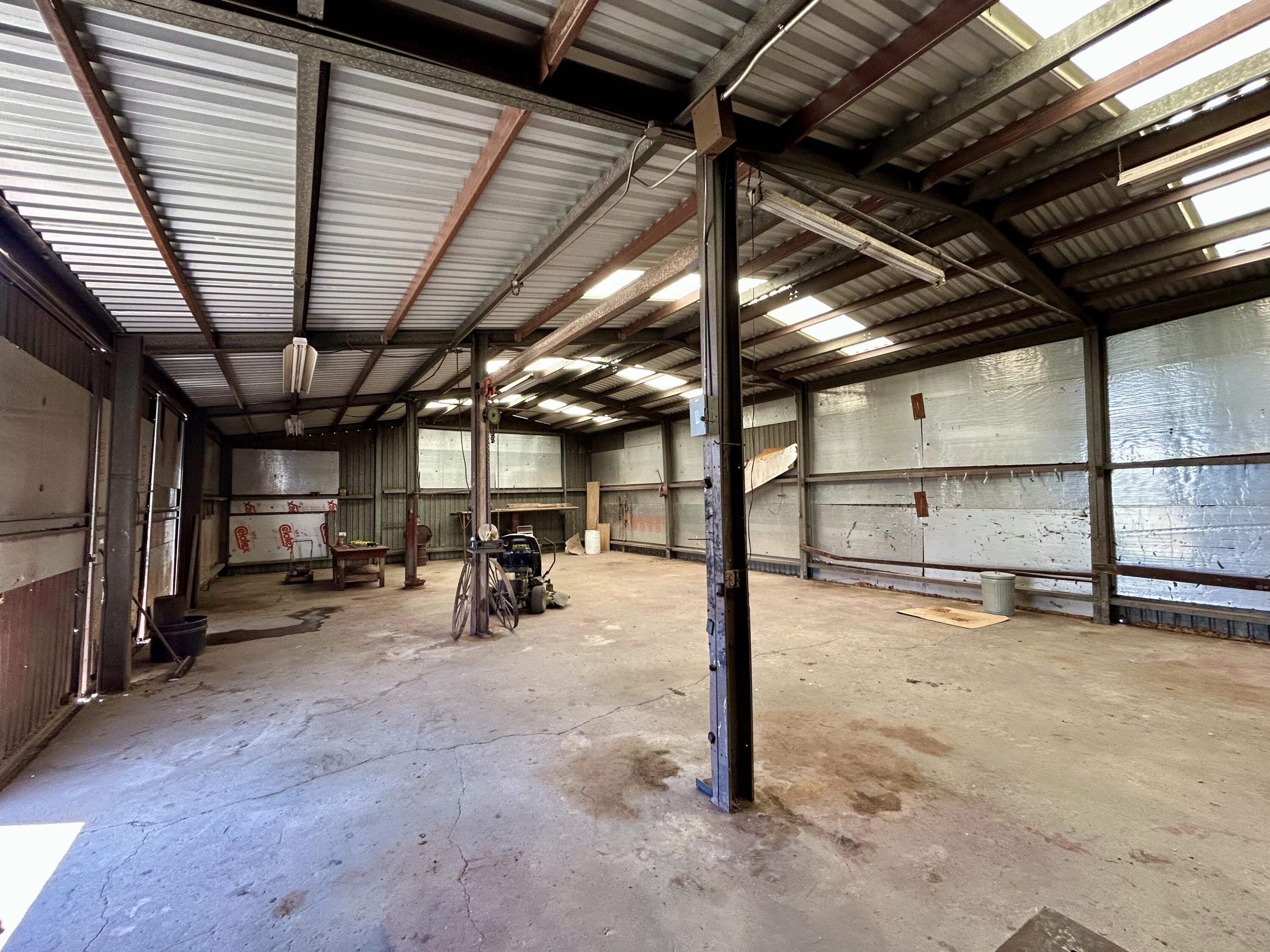 2101 Farm To Market 97 Lockney, TX 79241 - Photo 24 of 35 a view of a garage with wooden table