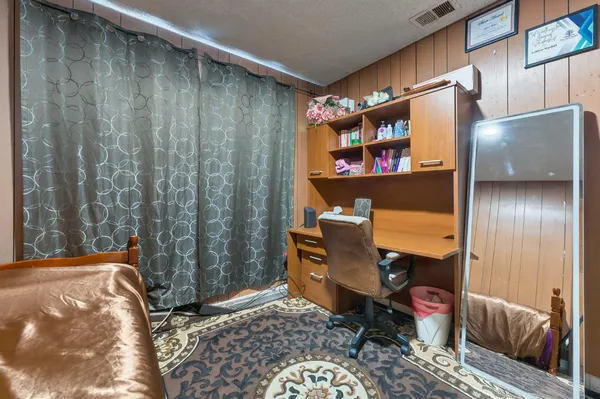 a room with furniture and a rug