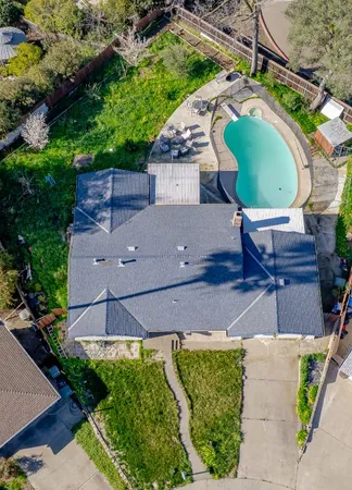 an aerial view of a city and mountain view in back