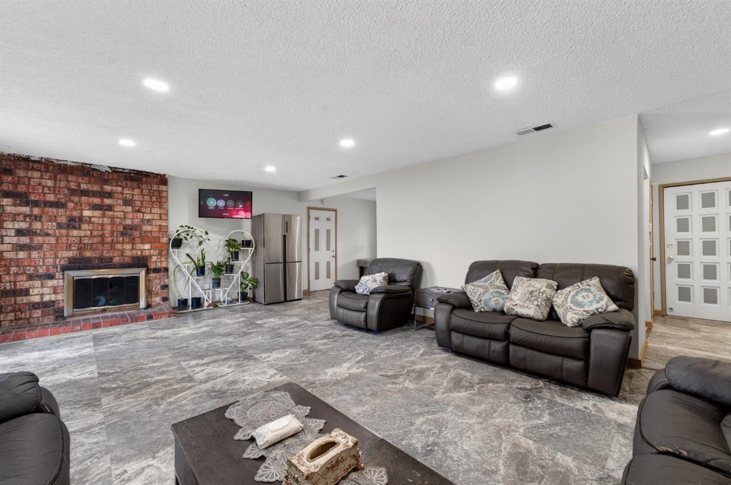 6500 Cookson Way Fair Oaks, CA 95628 - Photo 4 of 37 a living room with furniture a fireplace and a fireplace