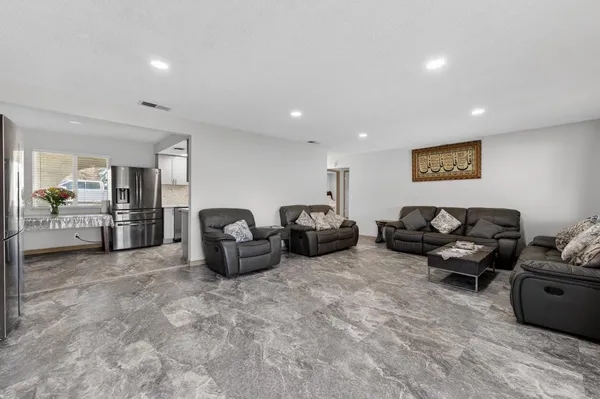 a living room with furniture and lots of furniture