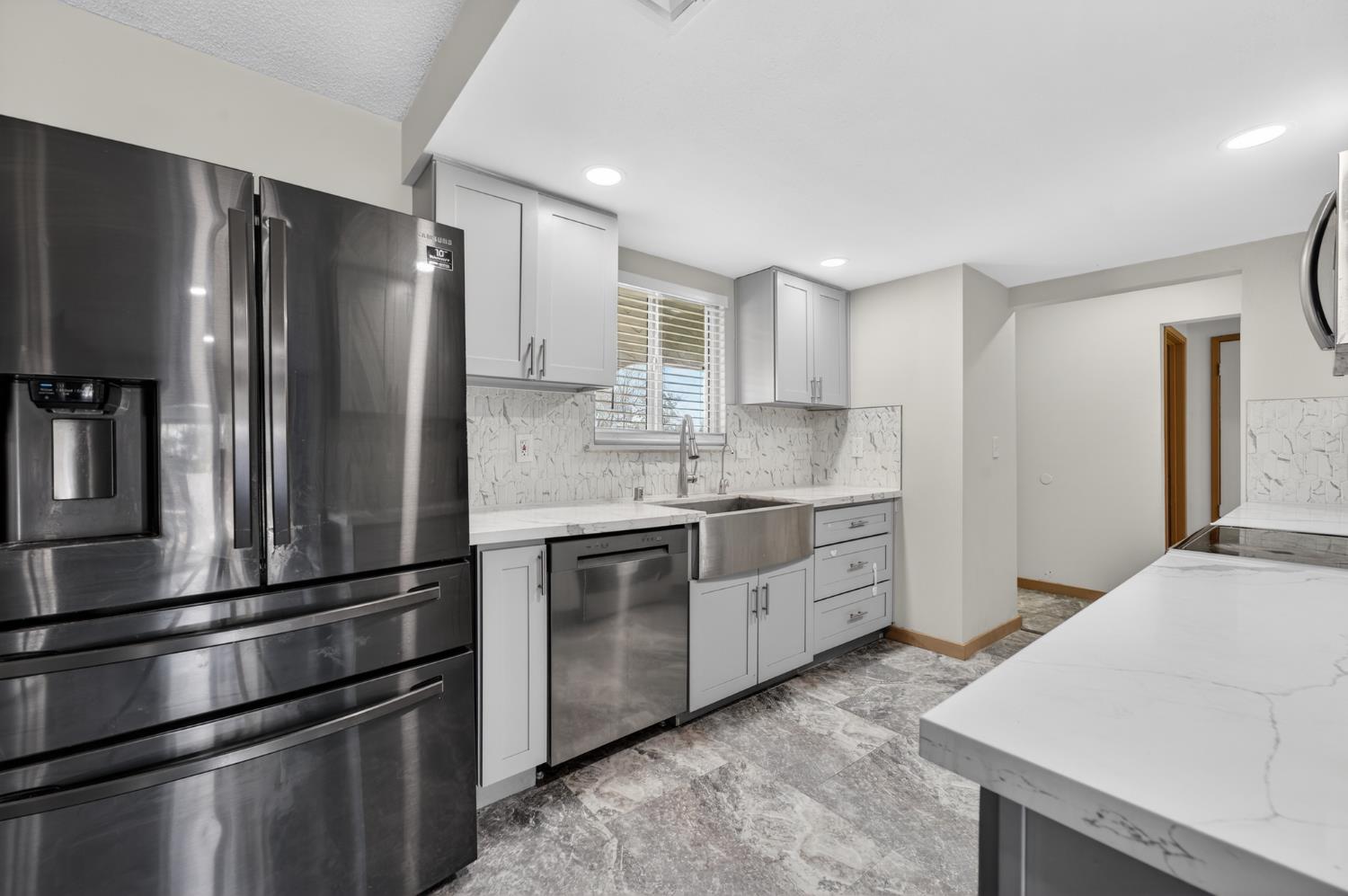 6500 Cookson Way Fair Oaks, CA 95628 - Photo 7 of 37 a kitchen with granite countertop stainless steel appliances and refrigerator