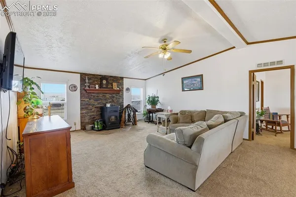 a living room with furniture a couch and a chandelier