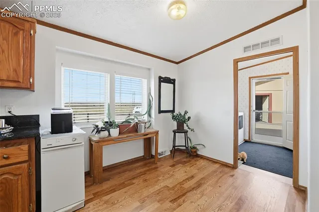 a kitchen with stainless steel appliances granite countertop a cabinets and a stove top oven