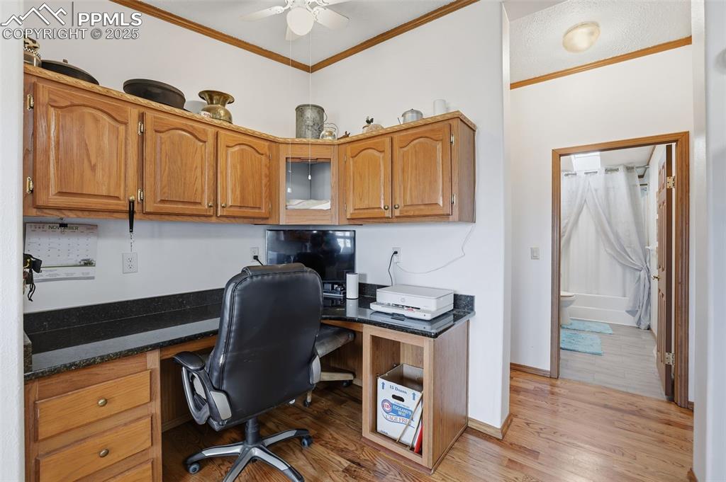 9235 Guthrie Road Calhan, CO 80808 - Photo 17 of 49 a kitchen with stainless steel appliances granite countertop a cabinets and a stove top oven