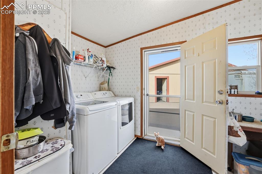 9235 Guthrie Road Calhan, CO 80808 - Photo 29 of 49 a utility room with dryer and washer