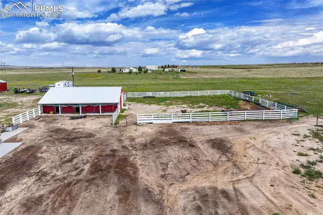 a view of a swimming pool with an outdoor seating