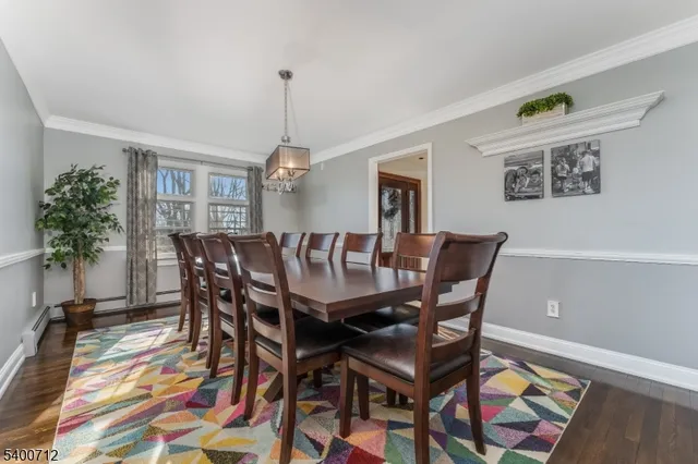 a view of a dining room with furniture and a rug
