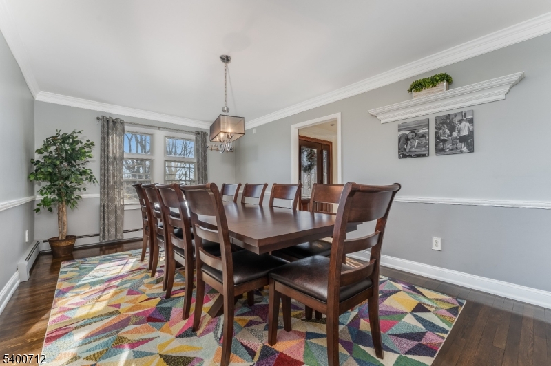 421 Adamic Hill Road Milford, NJ 08848 - Photo 11 of 45 a view of a dining room with furniture and a rug
