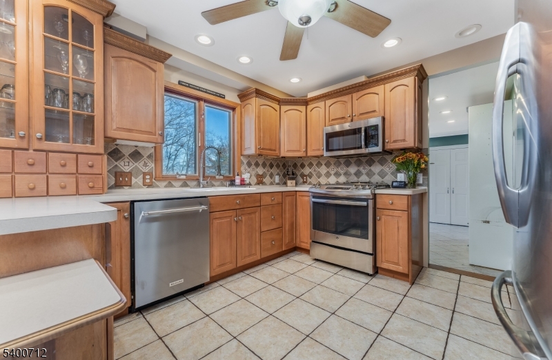 421 Adamic Hill Road Milford, NJ 08848 - Photo 12 of 45 a kitchen with stainless steel appliances granite countertop a stove a sink and a refrigerator