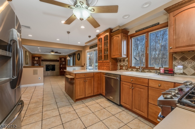 421 Adamic Hill Road Milford, NJ 08848 - Photo 13 of 45 a kitchen with stainless steel appliances granite countertop a sink and cabinets