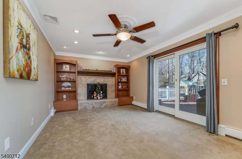 421 Adamic Hill Road Milford, NJ 08848 - Photo 17 of 45 a view of an empty room with a fireplace and a window