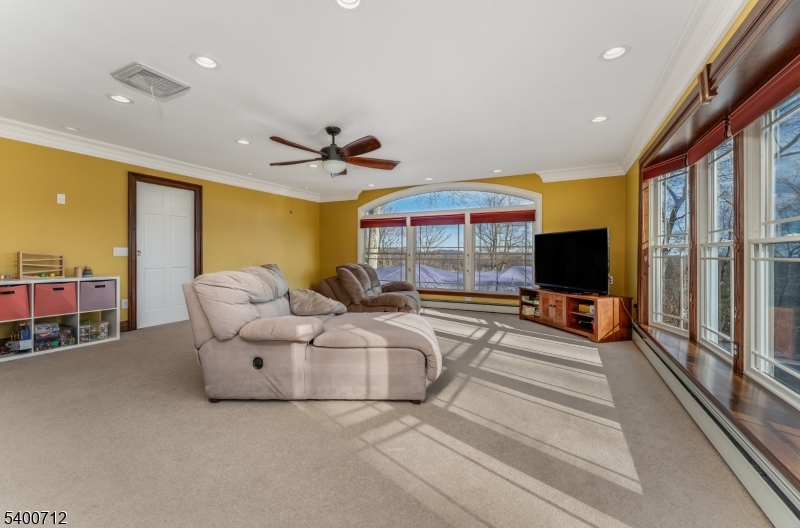 421 Adamic Hill Road Milford, NJ 08848 - Photo 21 of 45 a living room with furniture and a flat screen tv