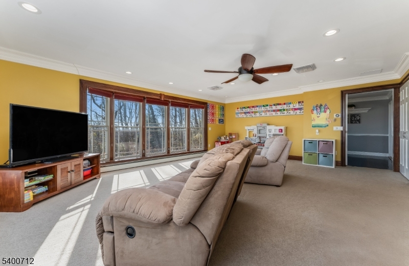421 Adamic Hill Road Milford, NJ 08848 - Photo 22 of 45 a living room with furniture and a flat screen tv