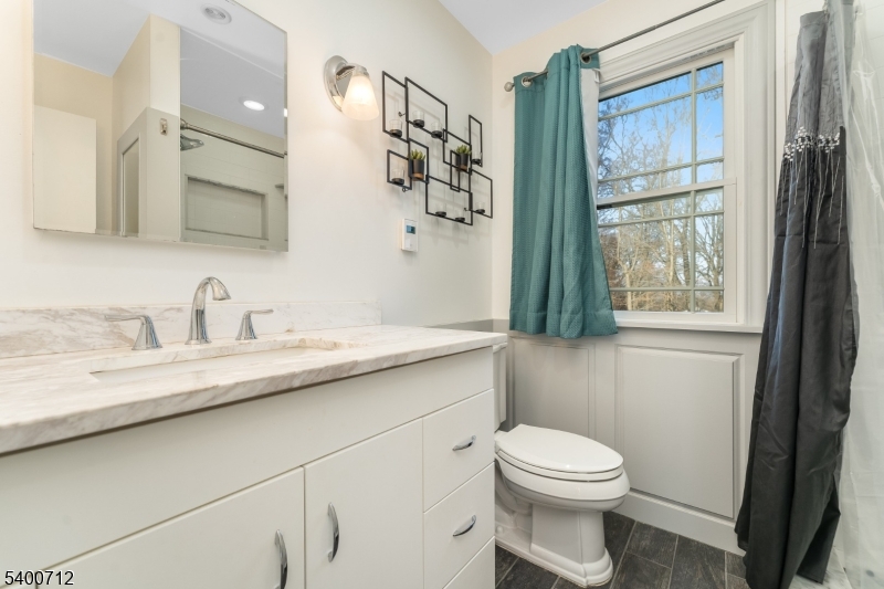 421 Adamic Hill Road Milford, NJ 08848 - Photo 24 of 45 a bathroom with a granite countertop toilet sink and mirror
