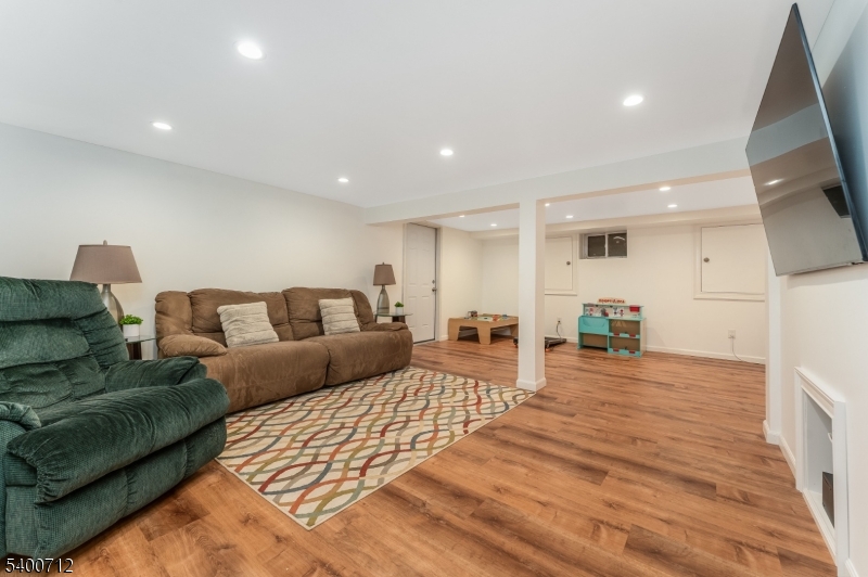 421 Adamic Hill Road Milford, NJ 08848 - Photo 31 of 45 a living room with furniture and a wooden floor