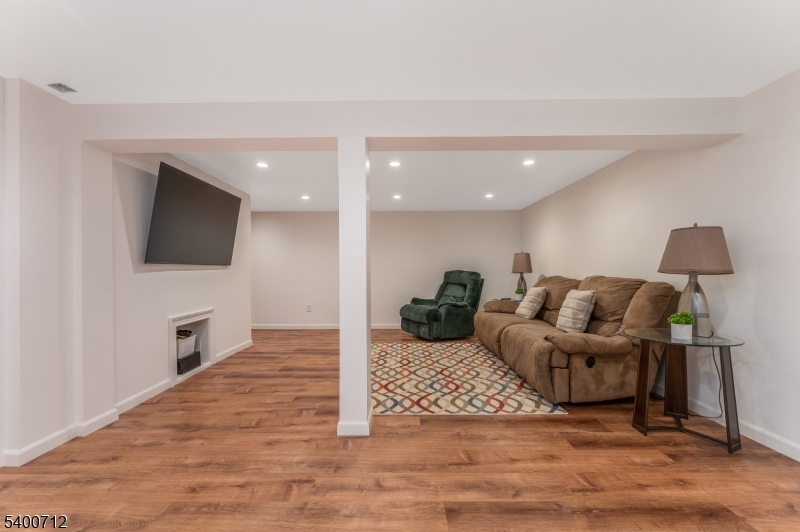 421 Adamic Hill Road Milford, NJ 08848 - Photo 32 of 45 a living room with furniture and a flat screen tv