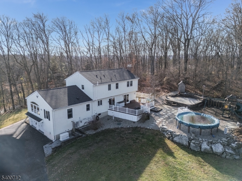 421 Adamic Hill Road Milford, NJ 08848 - Photo 41 of 45 a view of a wooden house with a yard and sitting area