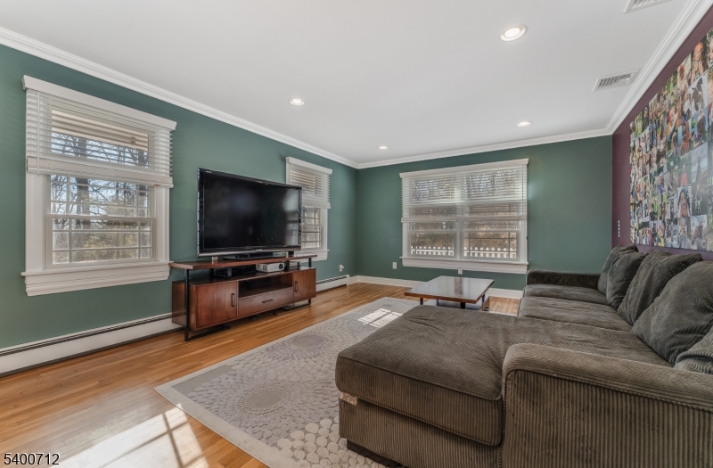 421 Adamic Hill Road Milford, NJ 08848 - Photo 8 of 45 a living room with furniture and a flat screen tv