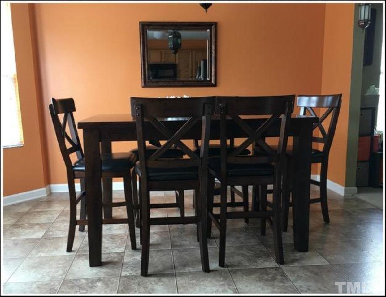 1012 Lombar Street Raleigh, NC 27610 - Photo 11 of 20 a view of a dining room with furniture and wooden floor