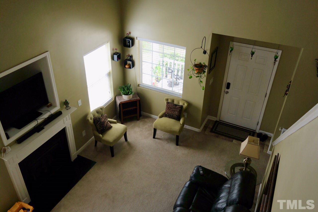 1012 Lombar Street Raleigh, NC 27610 - Photo 13 of 20 a living room with furniture and a flat screen tv