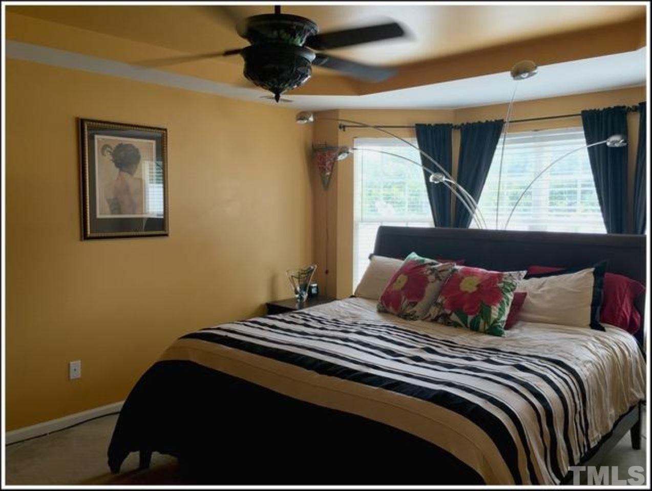 1012 Lombar Street Raleigh, NC 27610 - Photo 14 of 20 a bedroom with a bed and window