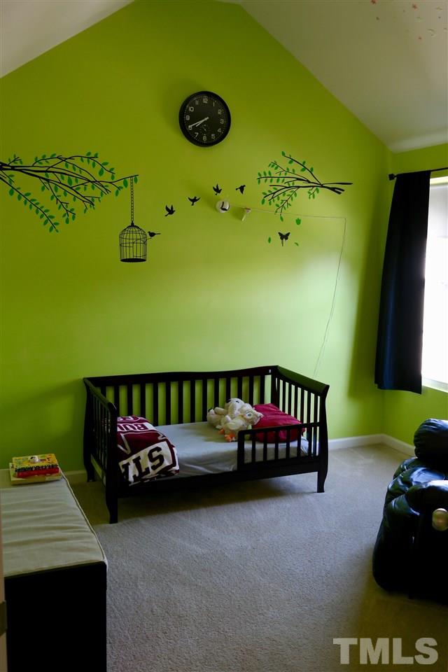 1012 Lombar Street Raleigh, NC 27610 - Photo 18 of 20 a bedroom with furniture and a window