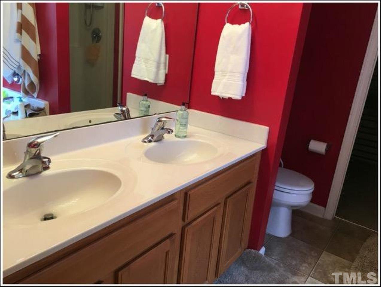 1012 Lombar Street Raleigh, NC 27610 - Photo 19 of 20 a bathroom with a sink and a mirror