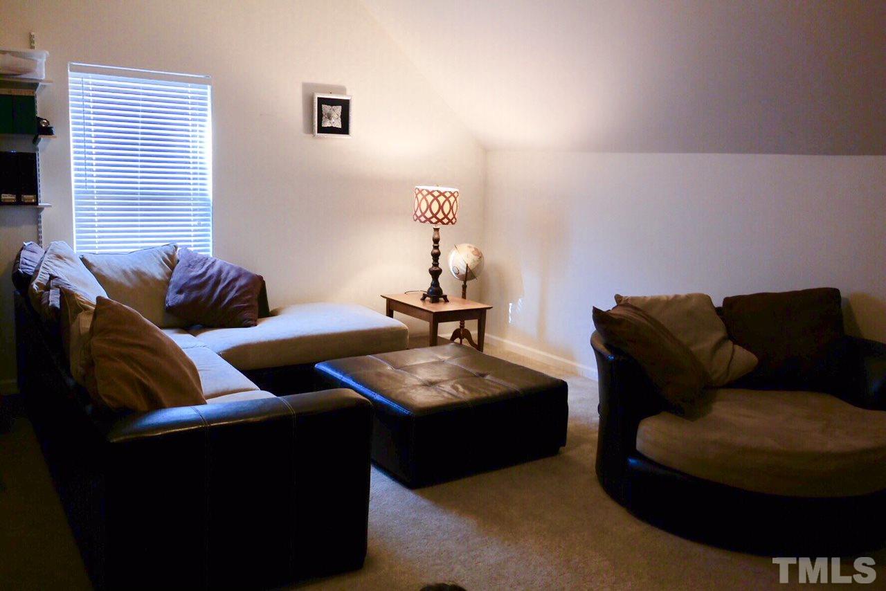 1012 Lombar Street Raleigh, NC 27610 - Photo 20 of 20 a living room with furniture and a window