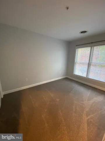 a view of balcony with wooden floor