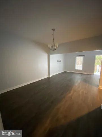 a bathroom with a double vanity sink toilet mirror and shower